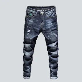 Dark wash men's ripped jeans